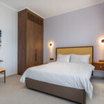 z luxury villa bita lefkada bedroom blanket pillows closet chair bedside table
