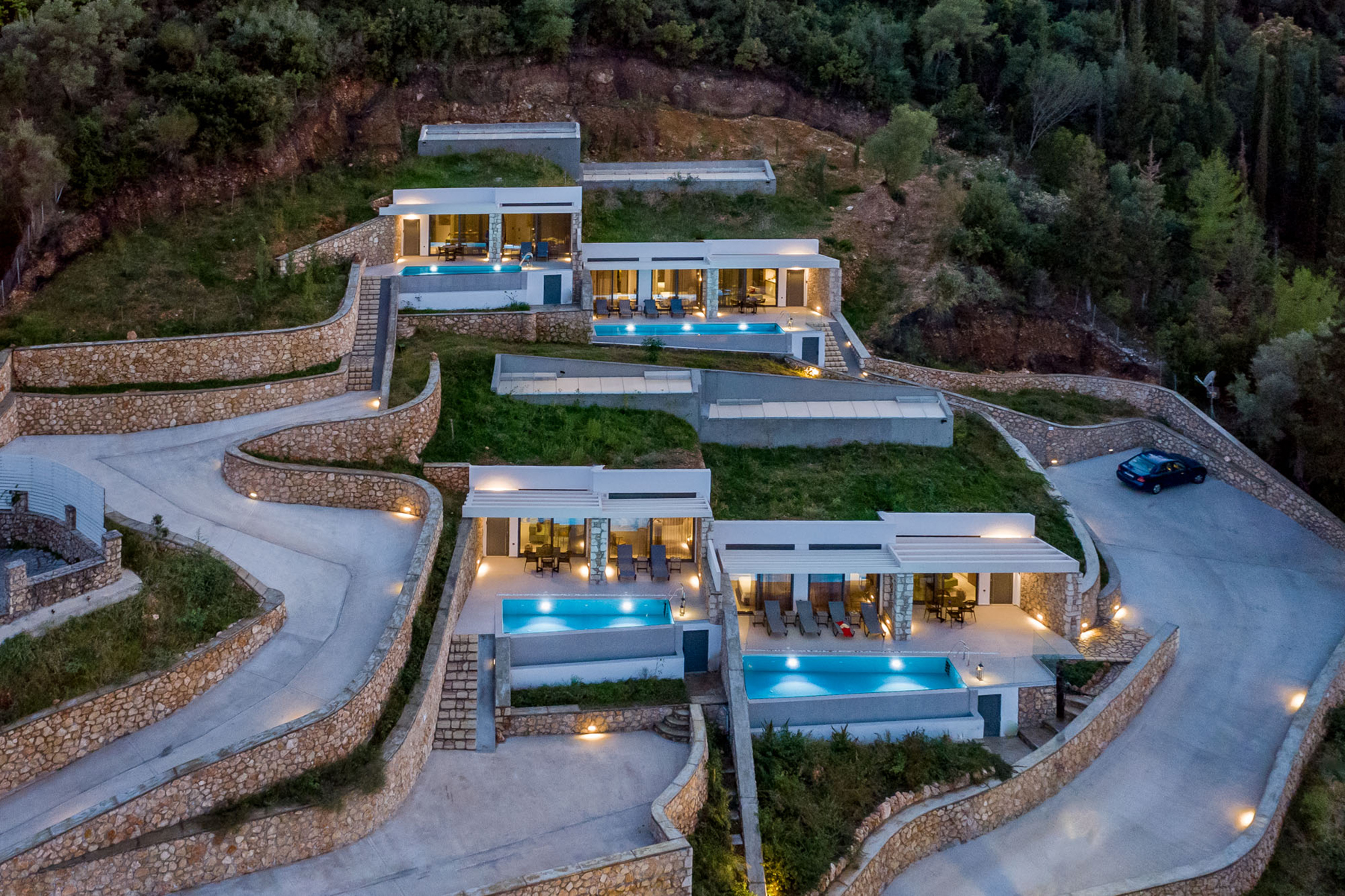 z luxury villa bita lefkada night four villas trees mountain parking area buildings swimming pool lights stairs