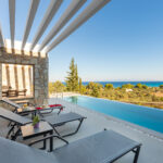 z luxury villa delta lefkada greece swimming pool beach chairs sea view trees