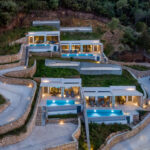 z luxury villa omega lefkada night four villas trees mountain parking area buildings swimming pool lights stairs
