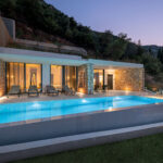 z luxury villa alpha lefkada greece swimming pool night building mountain trees garden